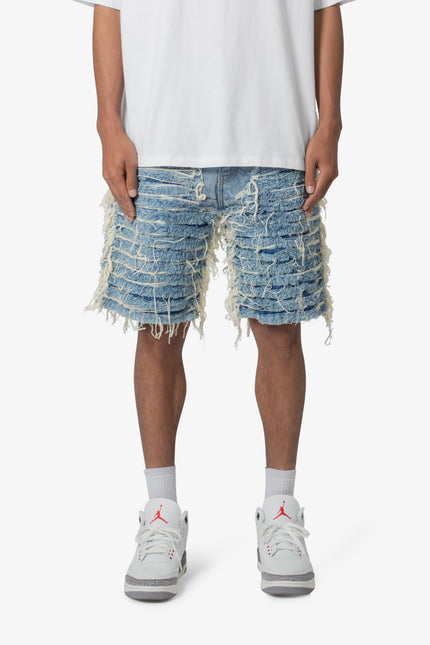 Pantalones cortos vaqueros deshilachados por toda la prenda - Azul